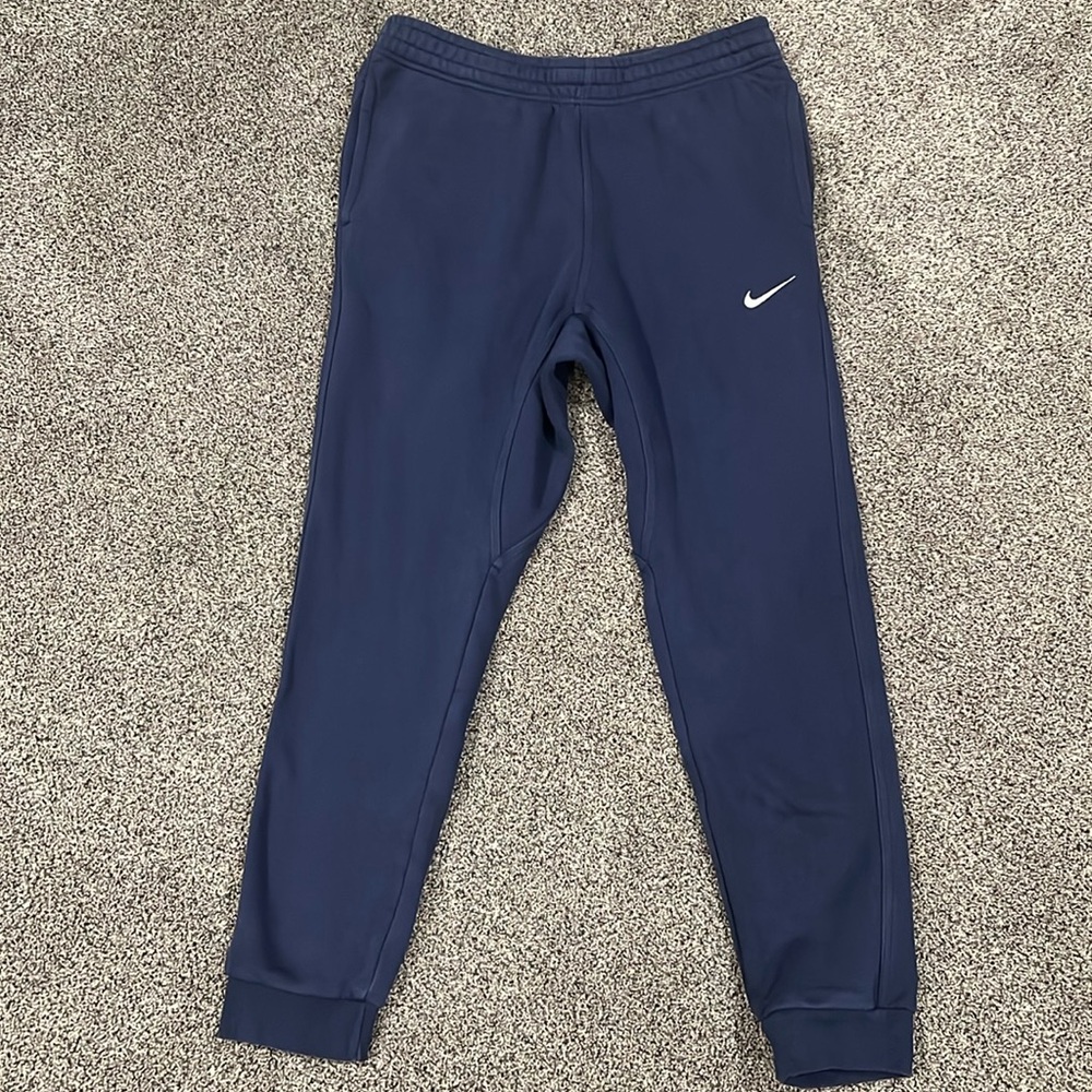 Navy blue Nike sweatpants.